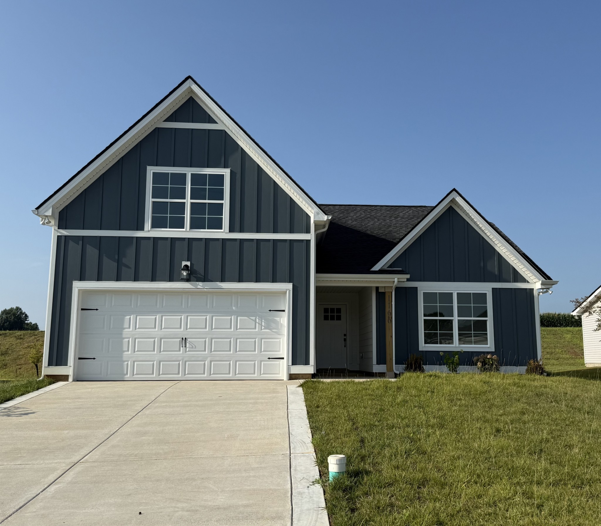 1166 Addler Drive Springfield, TN 37172 - Photo 1 of 10 a front view of a house with a yard and garage