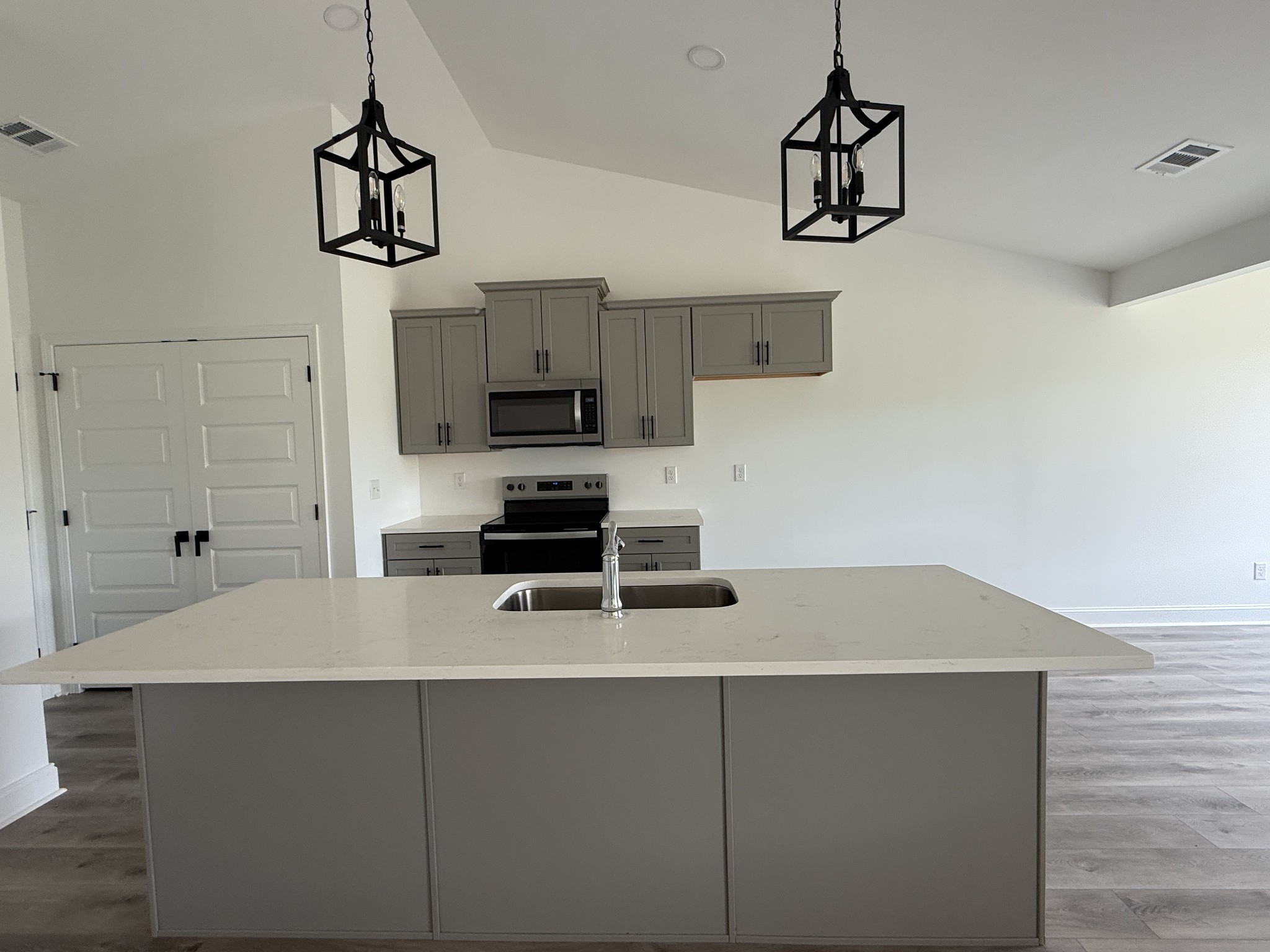 1166 Addler Drive Springfield, TN 37172 - Photo 2 of 10 a kitchen with stainless steel appliances a microwave and a refrigerator