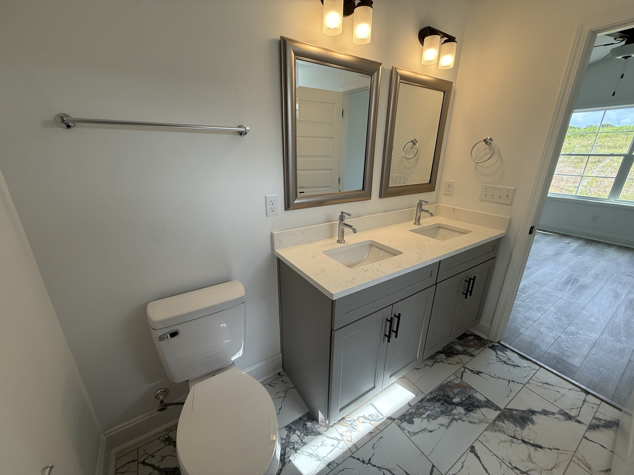 1166 Addler Drive Springfield, TN 37172 - Photo 4 of 10 a bathroom with a toilet sink and mirror