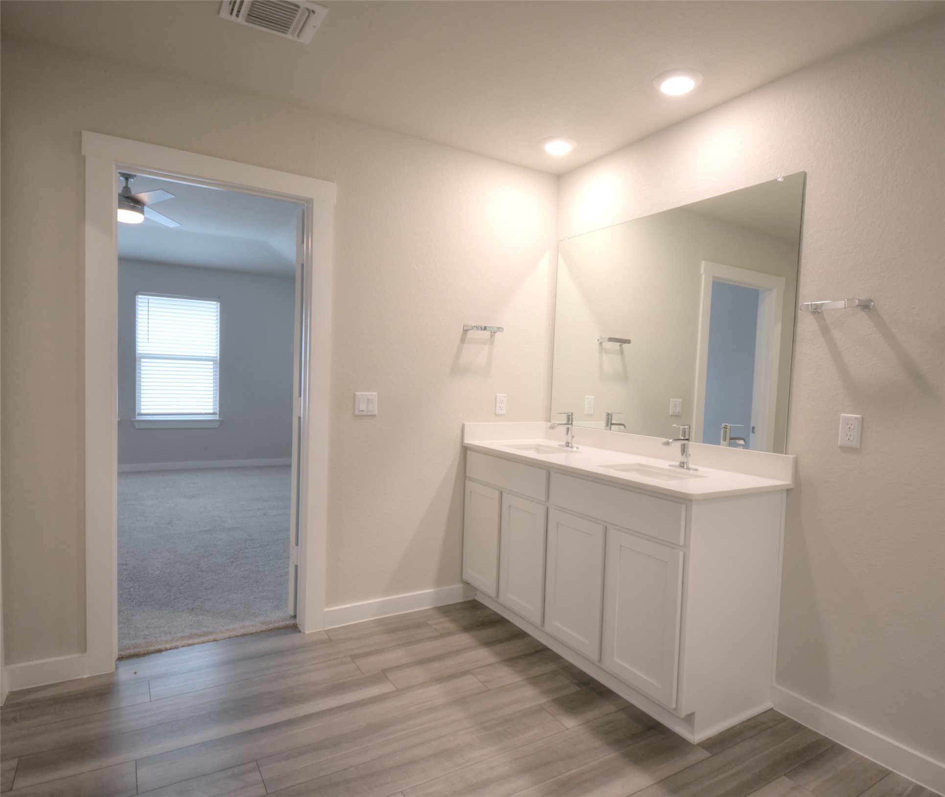1137 Tipton Street Georgetown, TX 78633 - Photo 9 of 18 Full bath with double vanity, light wood-style flooring.