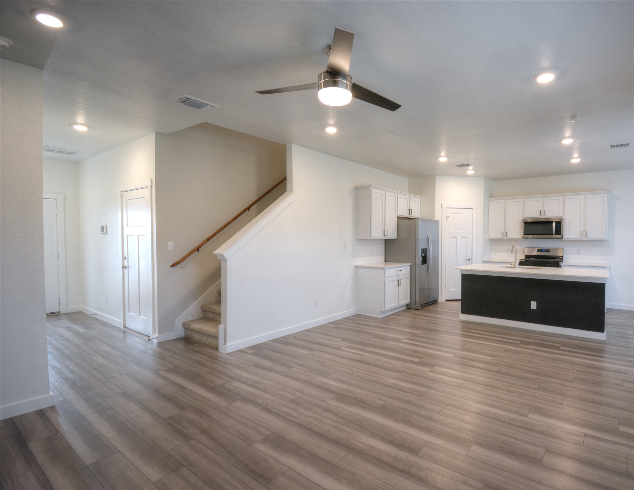 1137 Tipton Street Georgetown, TX 78633 - Photo 4 of 18 Living room with ceiling fan, recessed lighting, and light wood finished floors