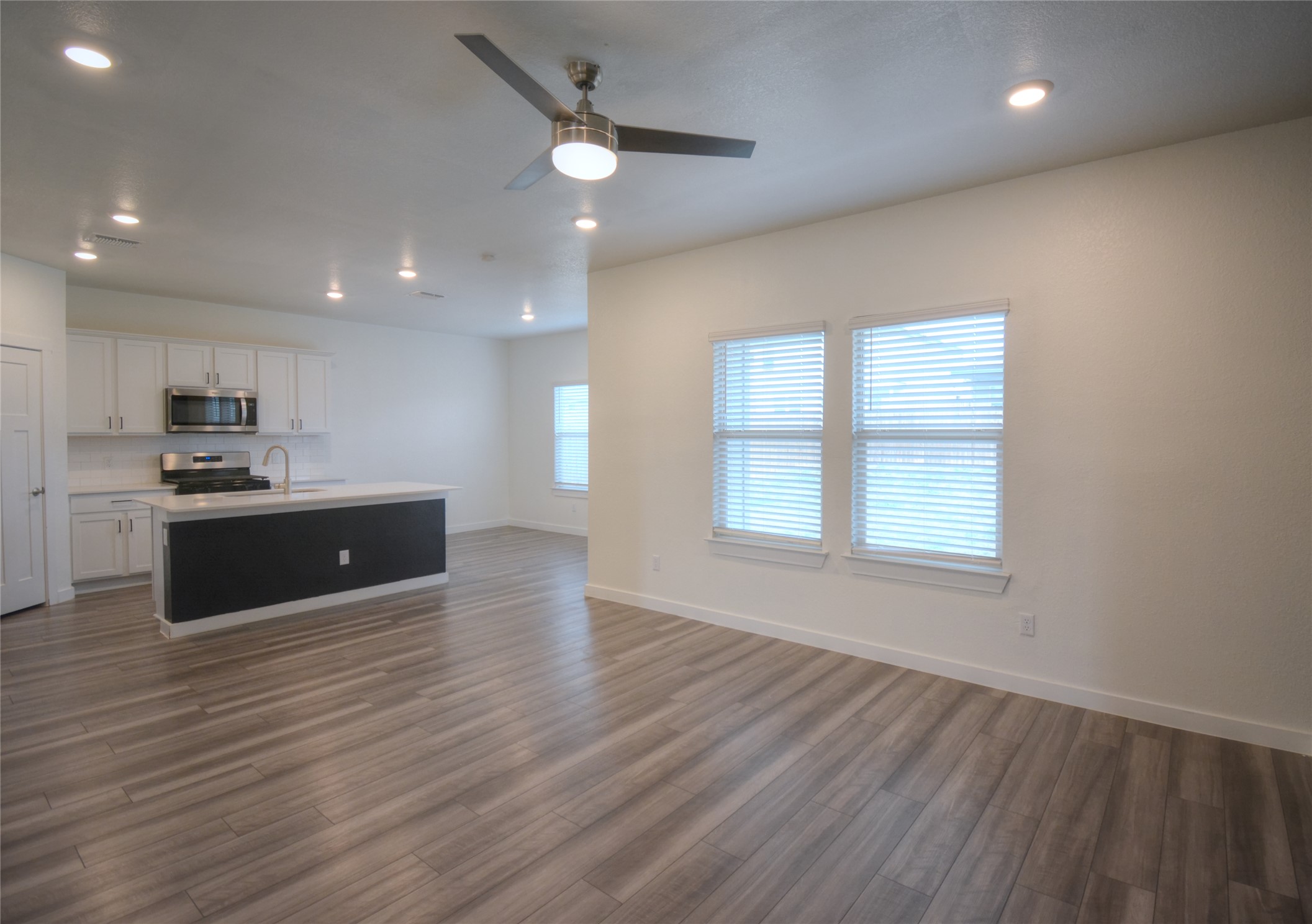 1137 Tipton Street Georgetown, TX 78633 - Photo 5 of 18 Living room with ceiling fan, recessed lighting, and light wood finished floors