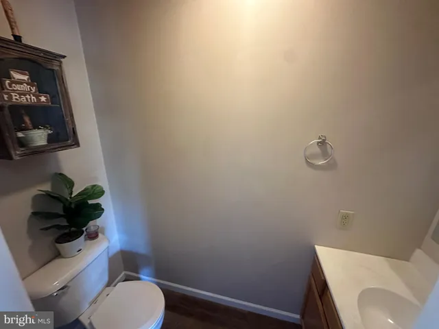 a kitchen with white cabinets and appliances