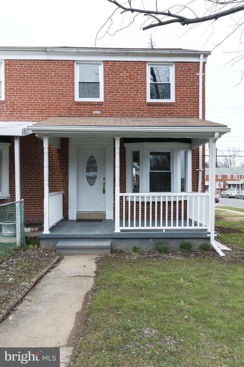 850 Arncliffe Road Baltimore, MD 21221 - Photo 22 of 24 front view of a house with a yard