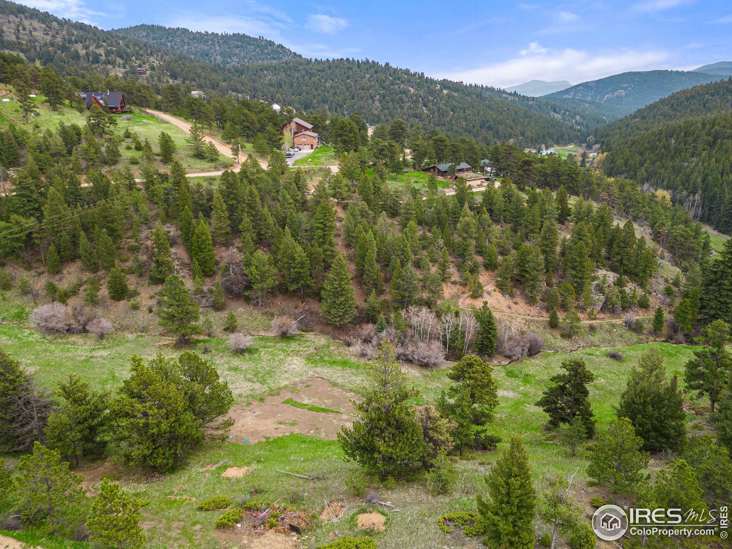 1111 Primos Road Boulder, CO 80302 - Photo 5 of 12 a view of a lush green hillside and houses