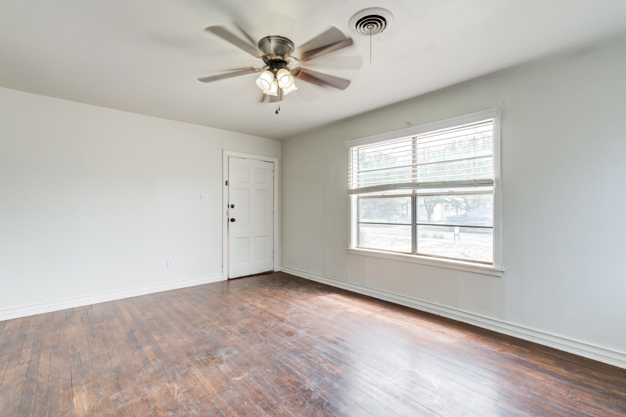 2308 30th Street Lubbock, TX 79411 - Photo 9 of 21 a view of an empty room with a window