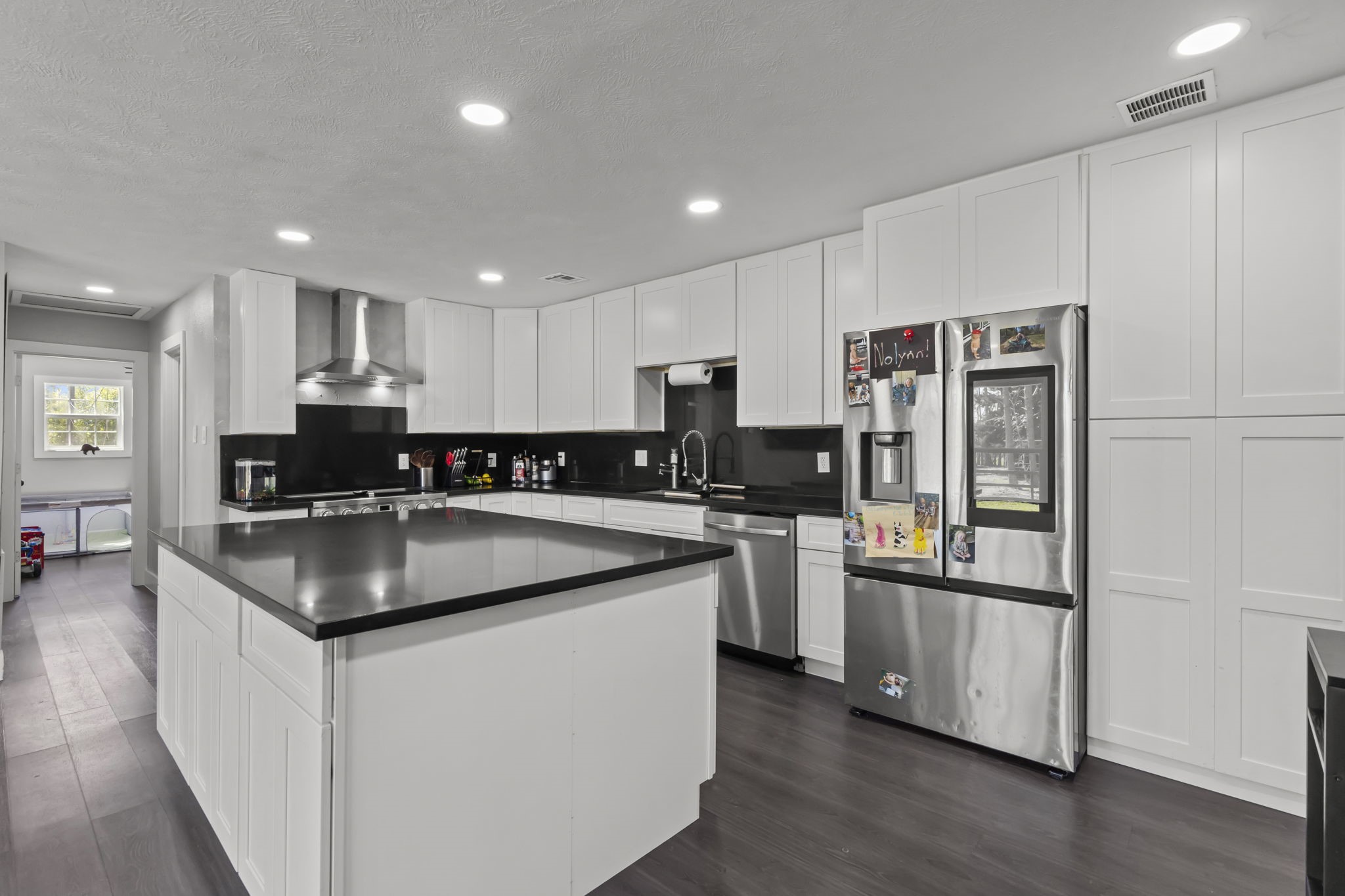 5406 South Tower Road Santa Fe, TX 77517 - Photo 12 of 46 a kitchen with stainless steel appliances granite countertop a sink stove and refrigerator