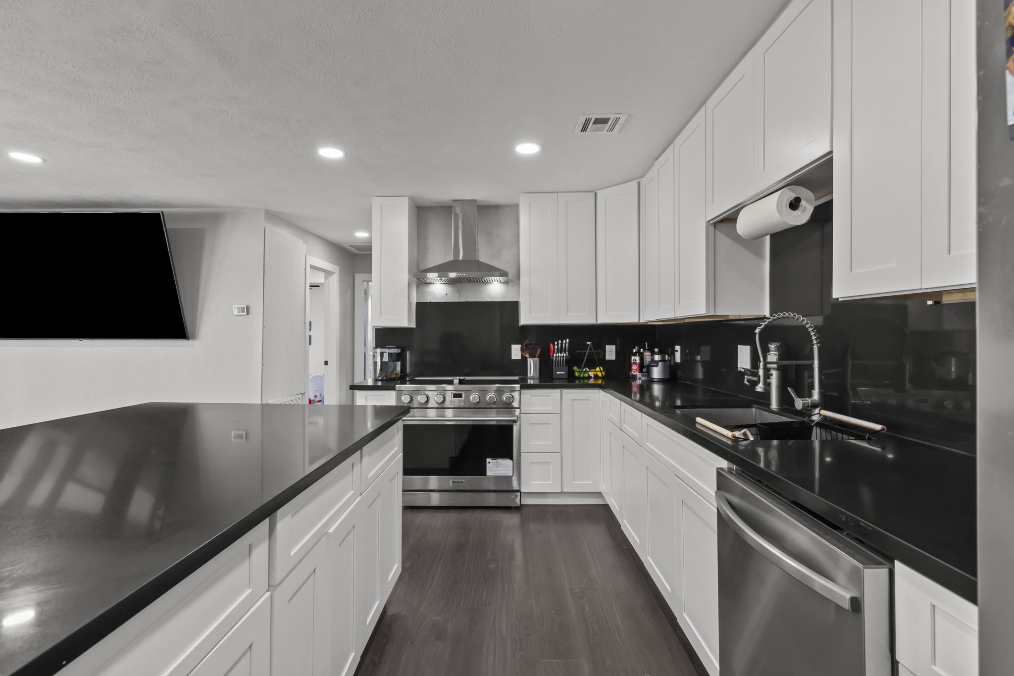 5406 South Tower Road Santa Fe, TX 77517 - Photo 14 of 46 a large kitchen with a sink and cabinets