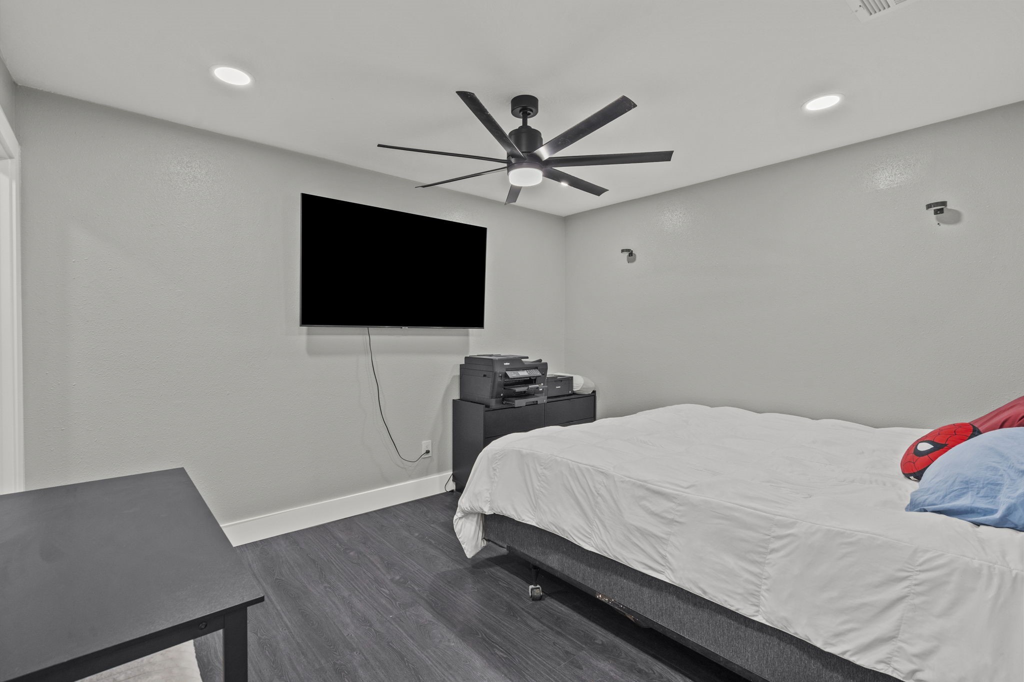 5406 South Tower Road Santa Fe, TX 77517 - Photo 17 of 46 a bedroom with a bed and a flat screen tv