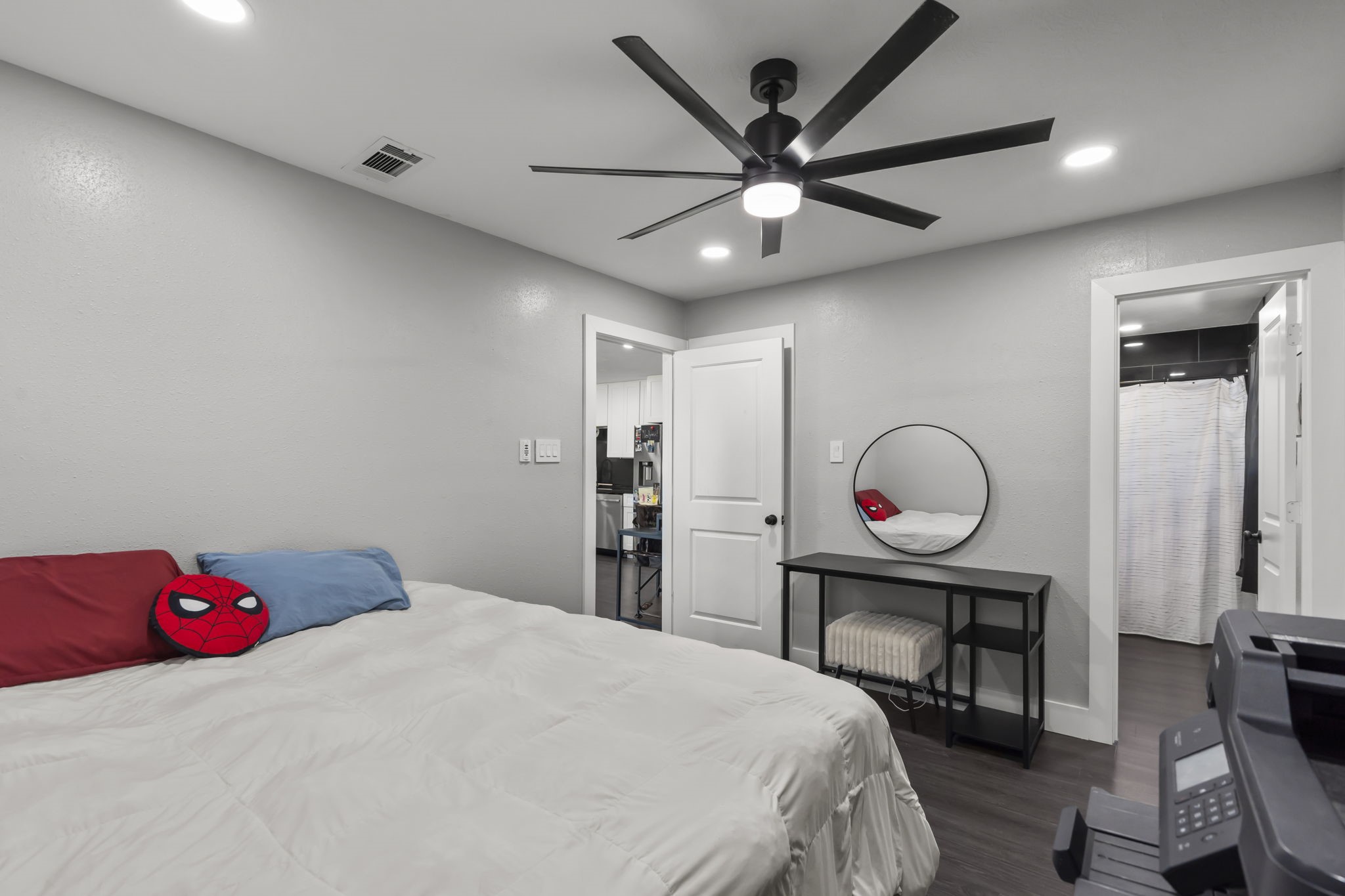 5406 South Tower Road Santa Fe, TX 77517 - Photo 18 of 46 a bedroom with a bed and a chandelier