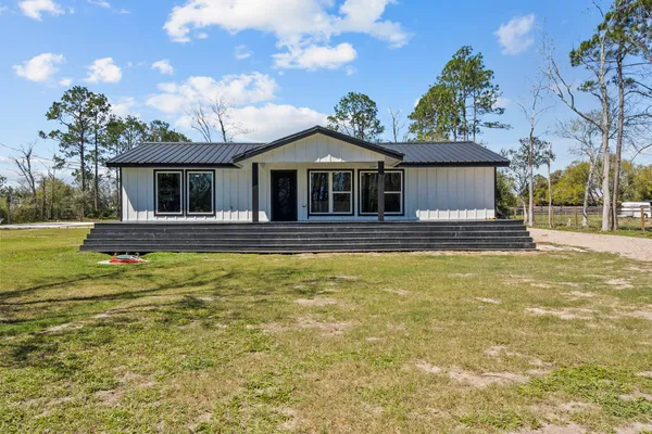 a front view of a house with swimming pool