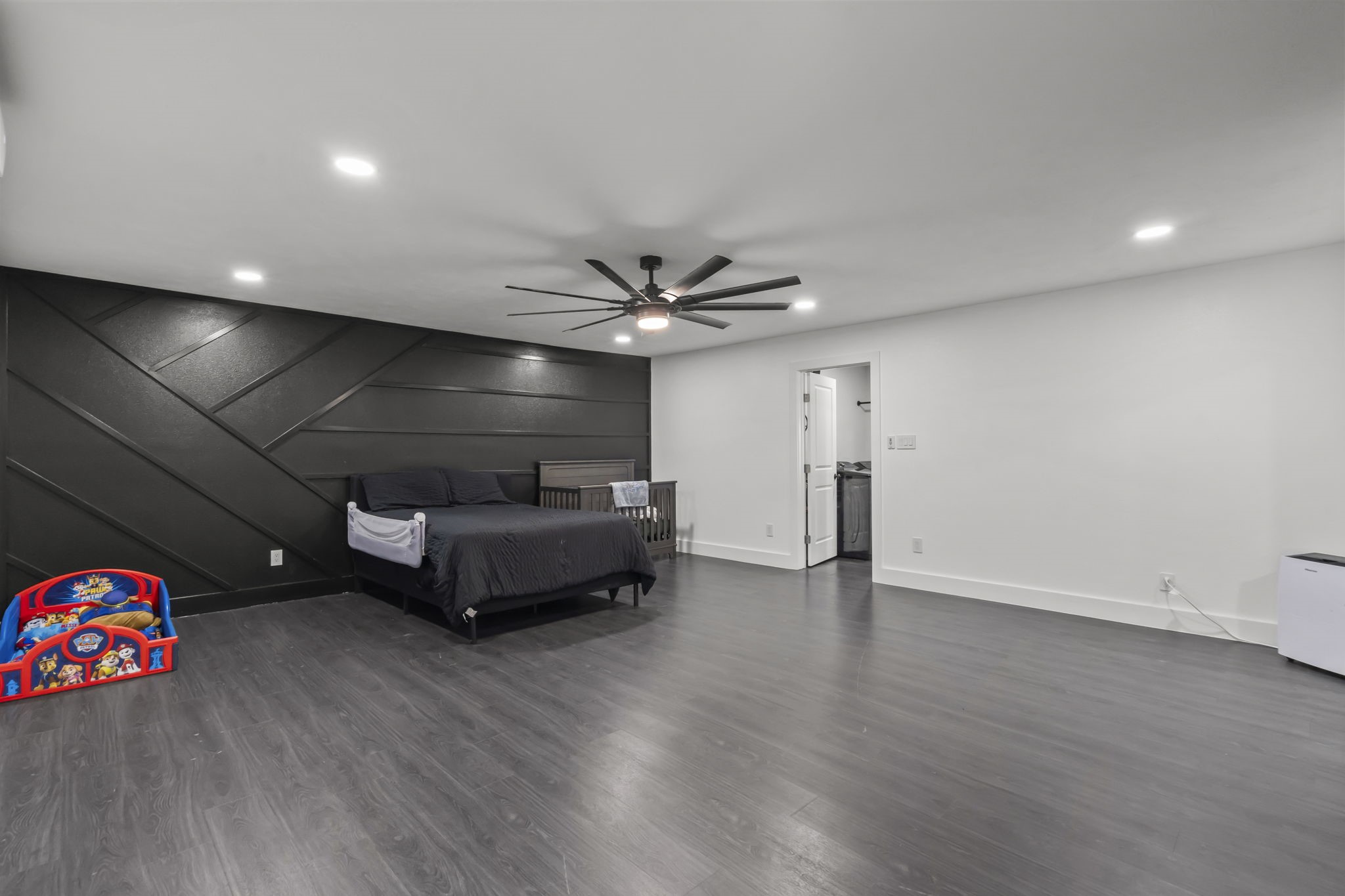 5406 South Tower Road Santa Fe, TX 77517 - Photo 23 of 46 an empty room with wooden floor and ceiling fan