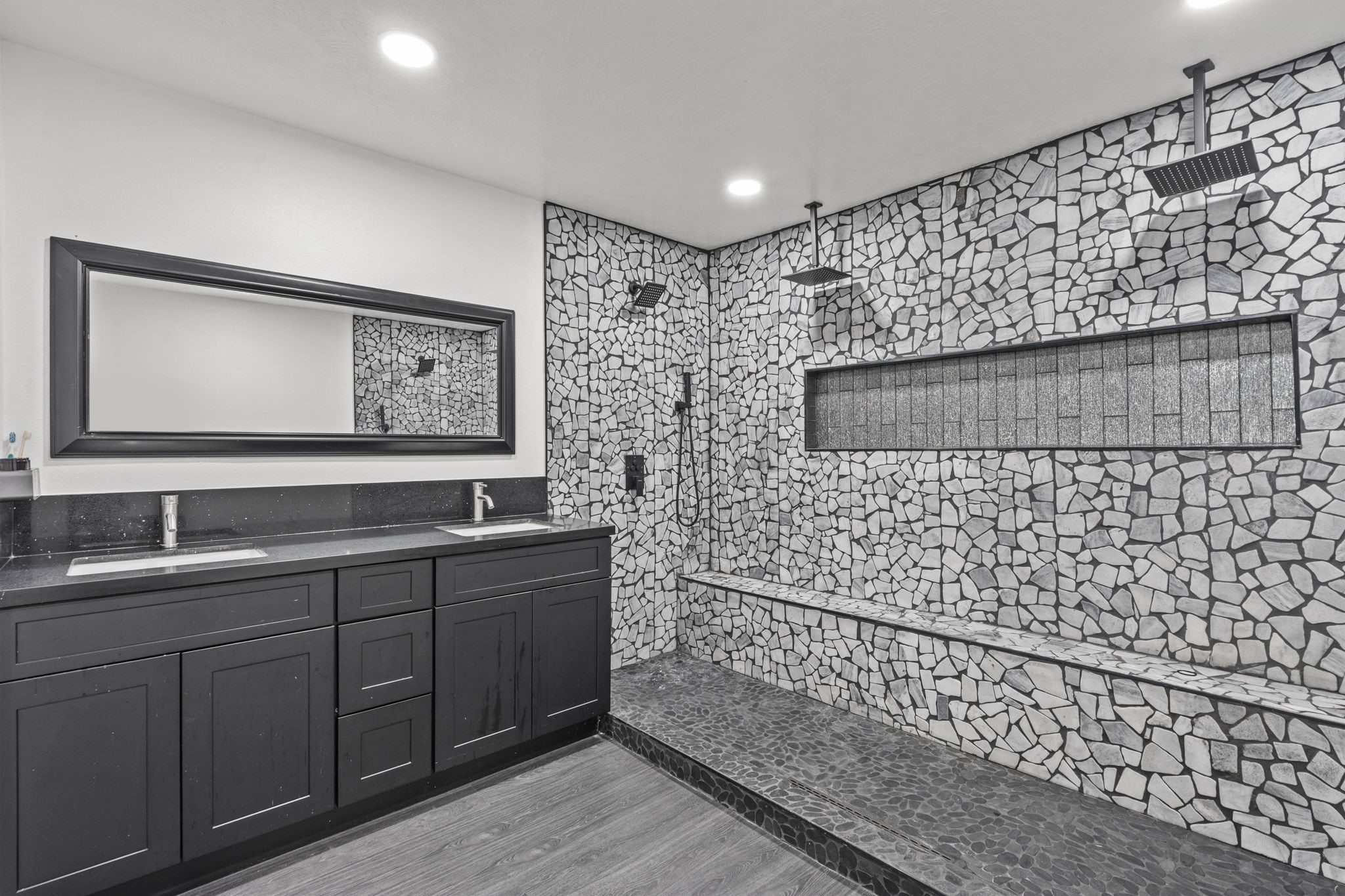 5406 South Tower Road Santa Fe, TX 77517 - Photo 26 of 46 a bathroom with a sink a mirror and shower