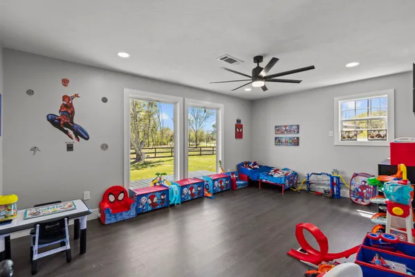 a view of a room with toys and a wooden floor