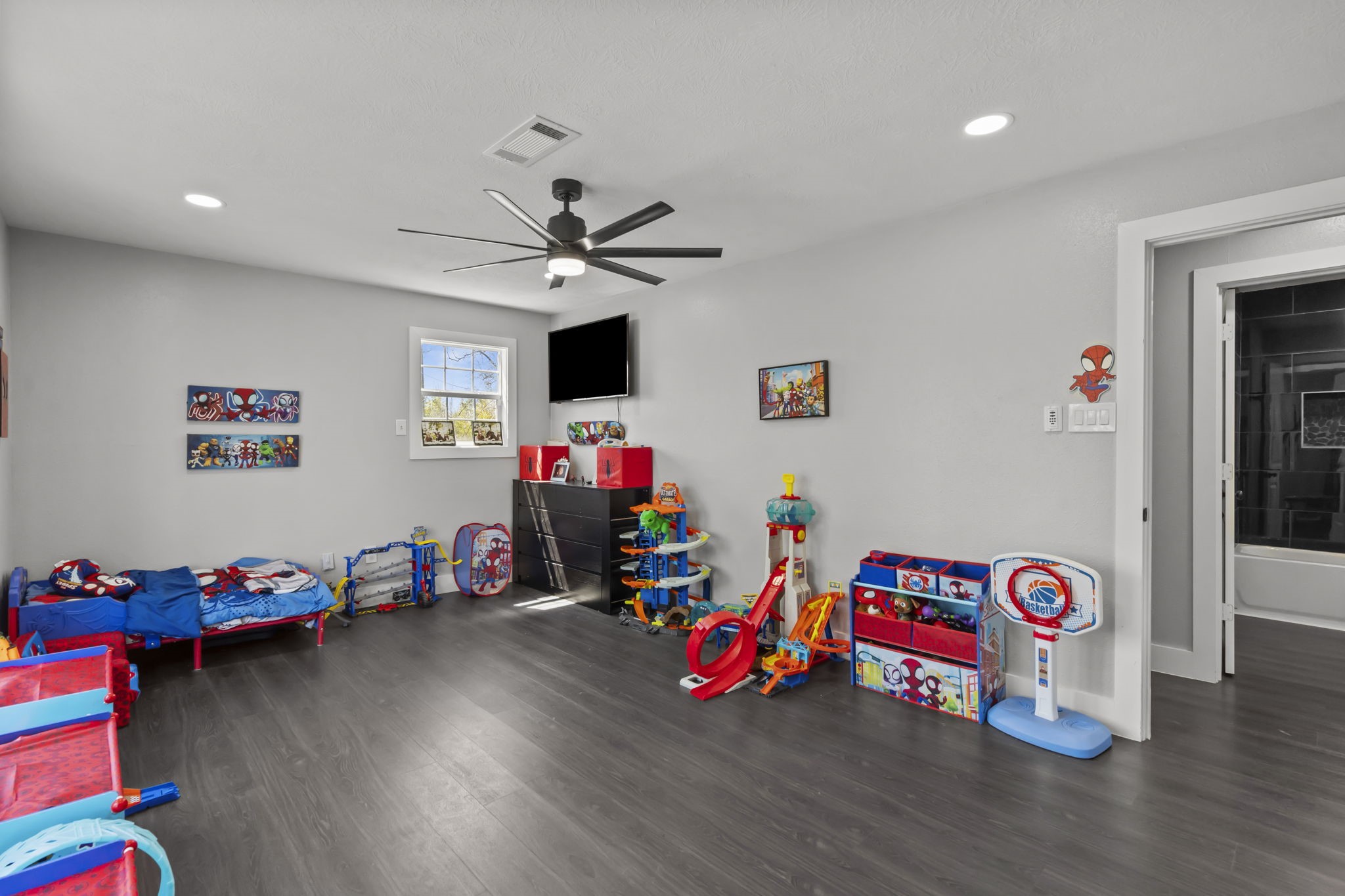 5406 South Tower Road Santa Fe, TX 77517 - Photo 30 of 46 a view of a room with toys and a wooden floor