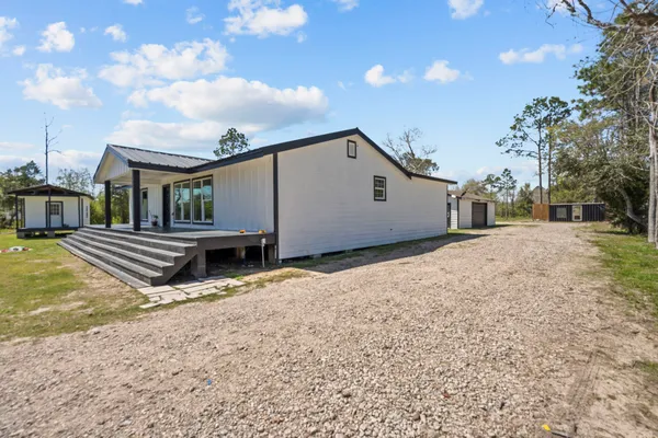 a view of swimming pool with porch and patio
