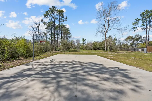 a view of an outdoor space and tennis court