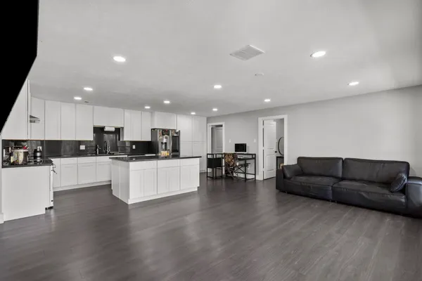 a large living room with a large window