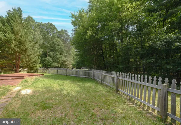 a view of a backyard with swimming pool
