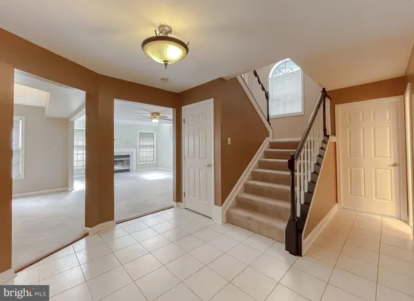 a view of a hallway view with staircase