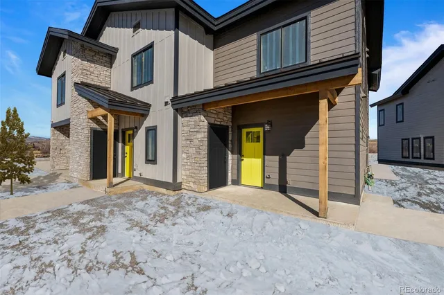 a view of a house with wooden fence