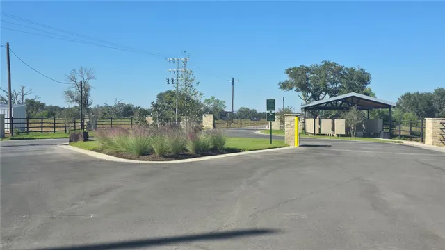 a view of a house with a garden and pathway