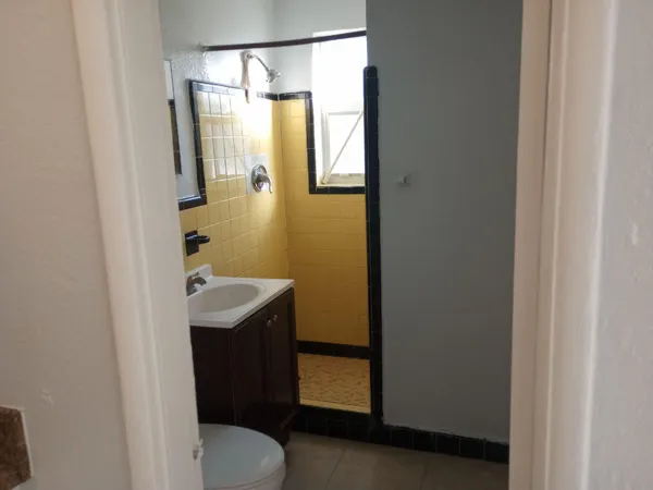 a bathroom with a sink and mirror