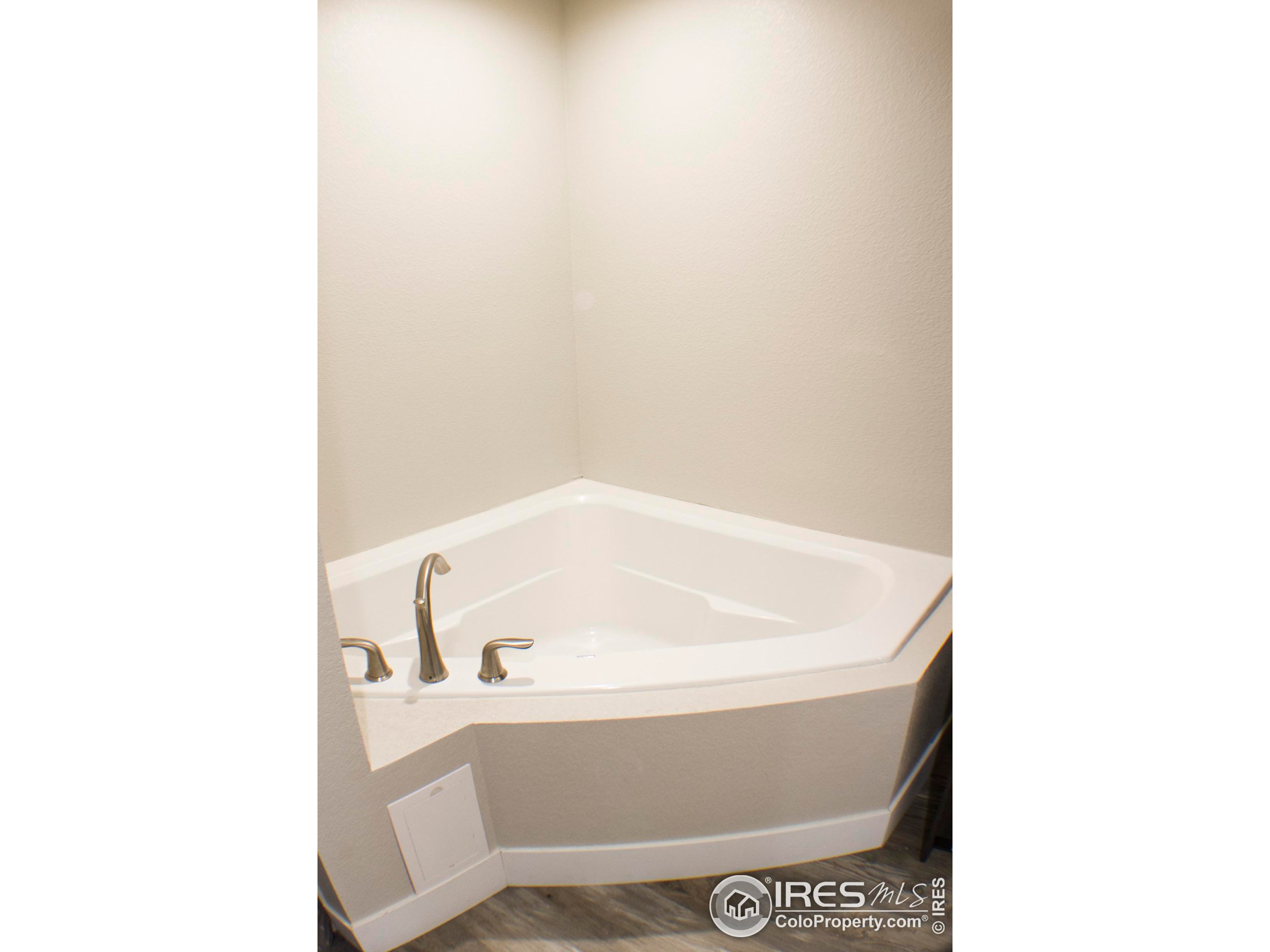 313 West Furry Street Holyoke, CO 80734 - Photo 12 of 23 a bath tub sitting in a bathroom