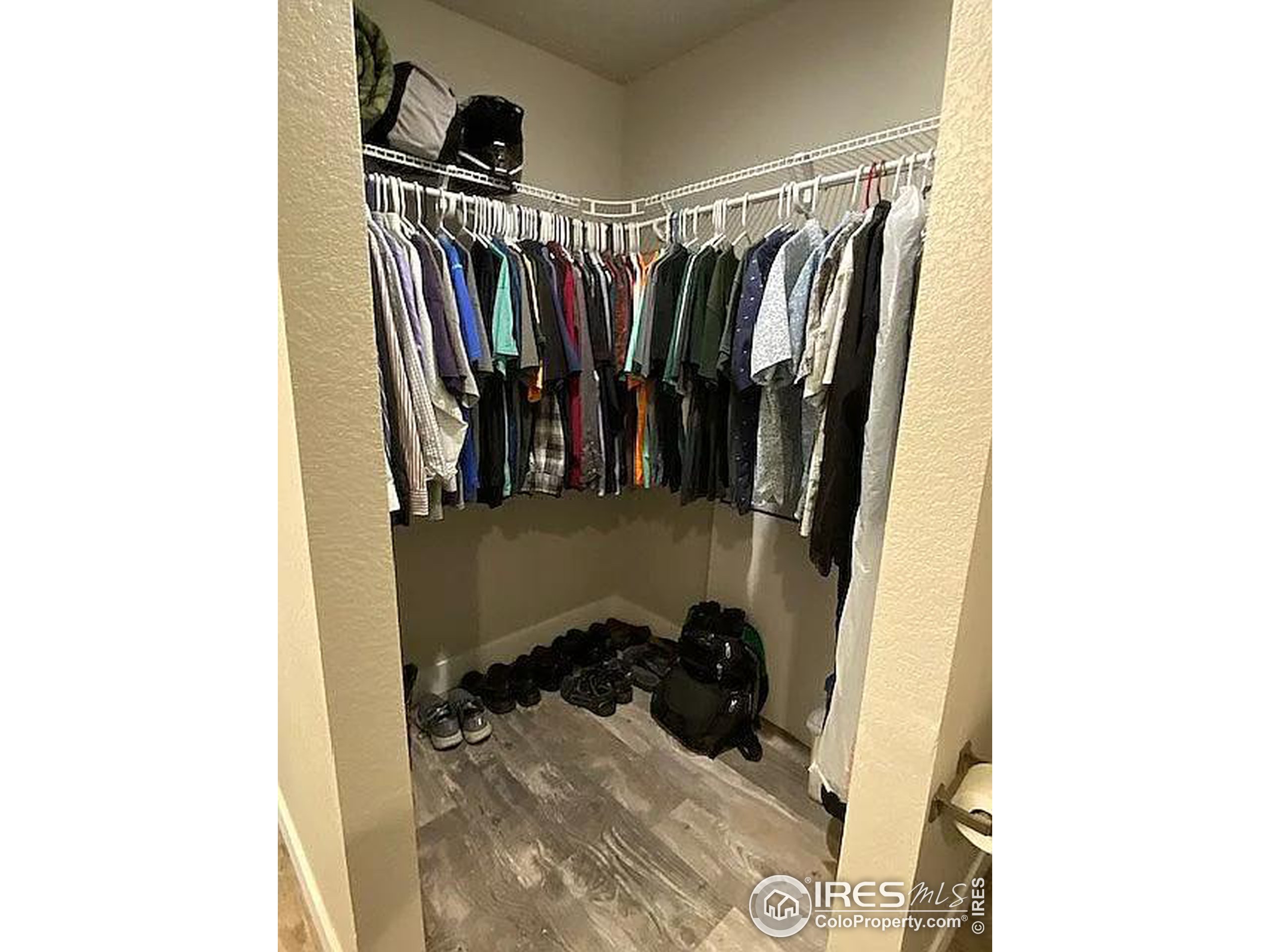 313 West Furry Street Holyoke, CO 80734 - Photo 14 of 23 a view of walk in closet with clothes and shoes