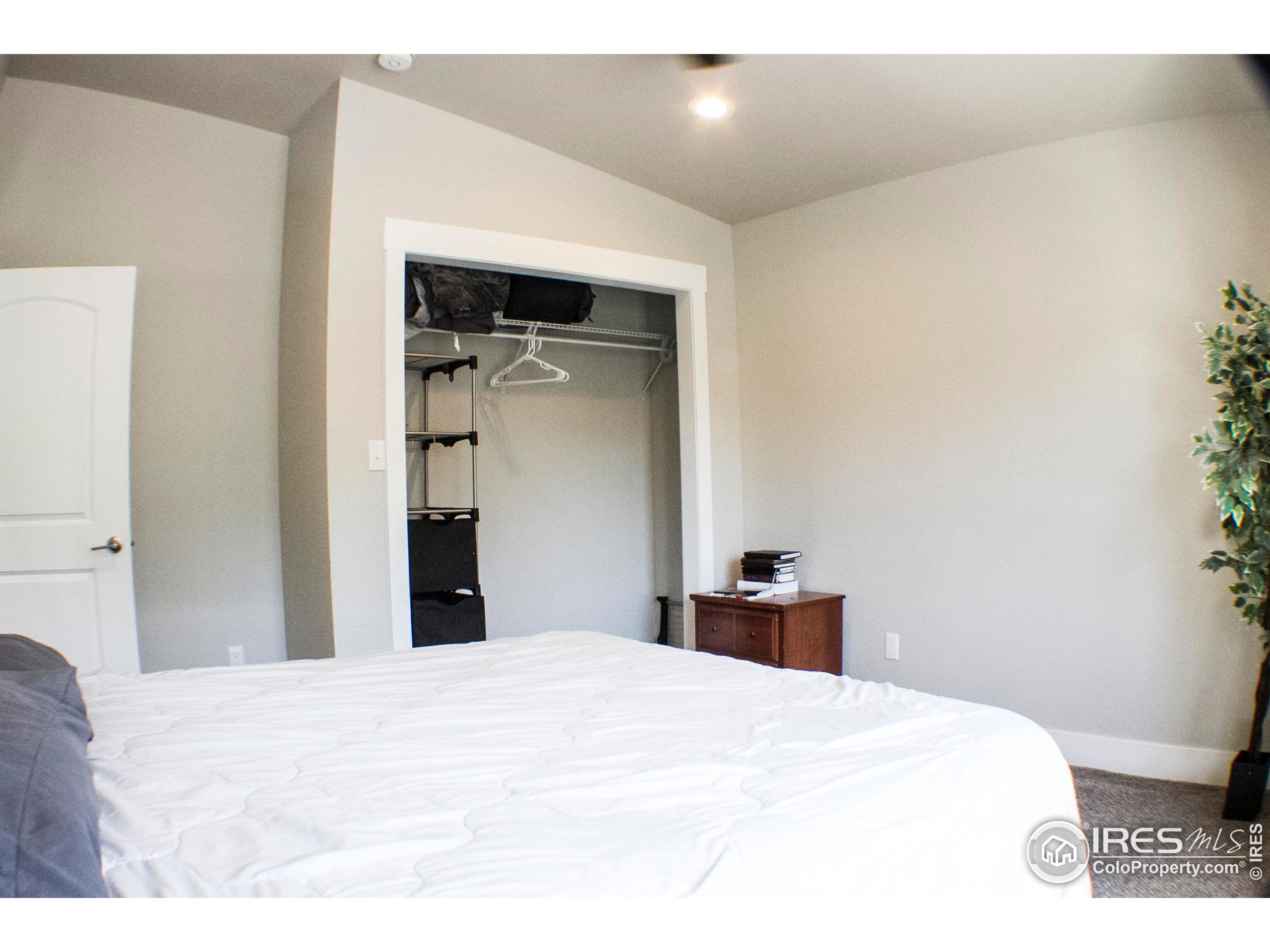 313 West Furry Street Holyoke, CO 80734 - Photo 16 of 23 a bedroom with a bed and a dresser