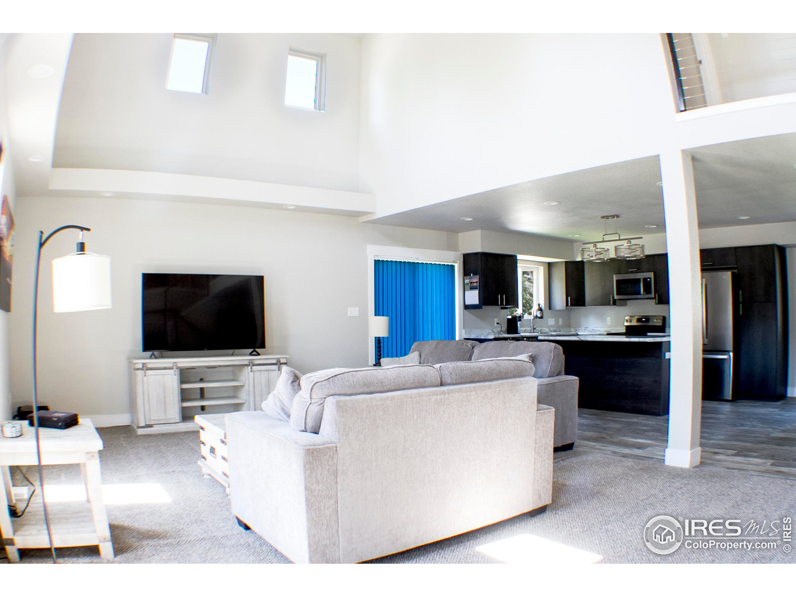 313 West Furry Street Holyoke, CO 80734 - Photo 3 of 23 a living room with furniture and a flat screen tv