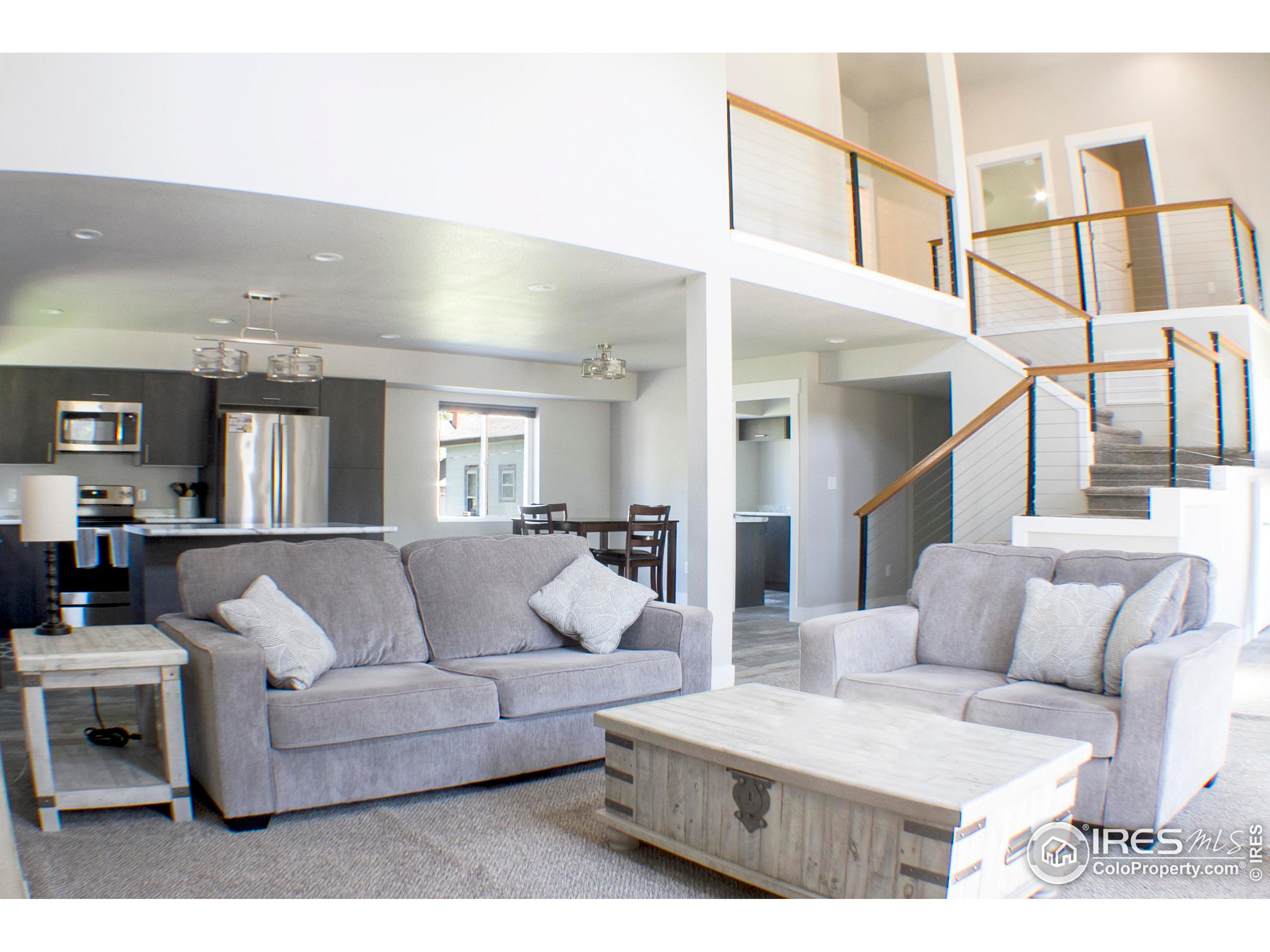 313 West Furry Street Holyoke, CO 80734 - Photo 4 of 23 a living room with furniture and a wooden floor