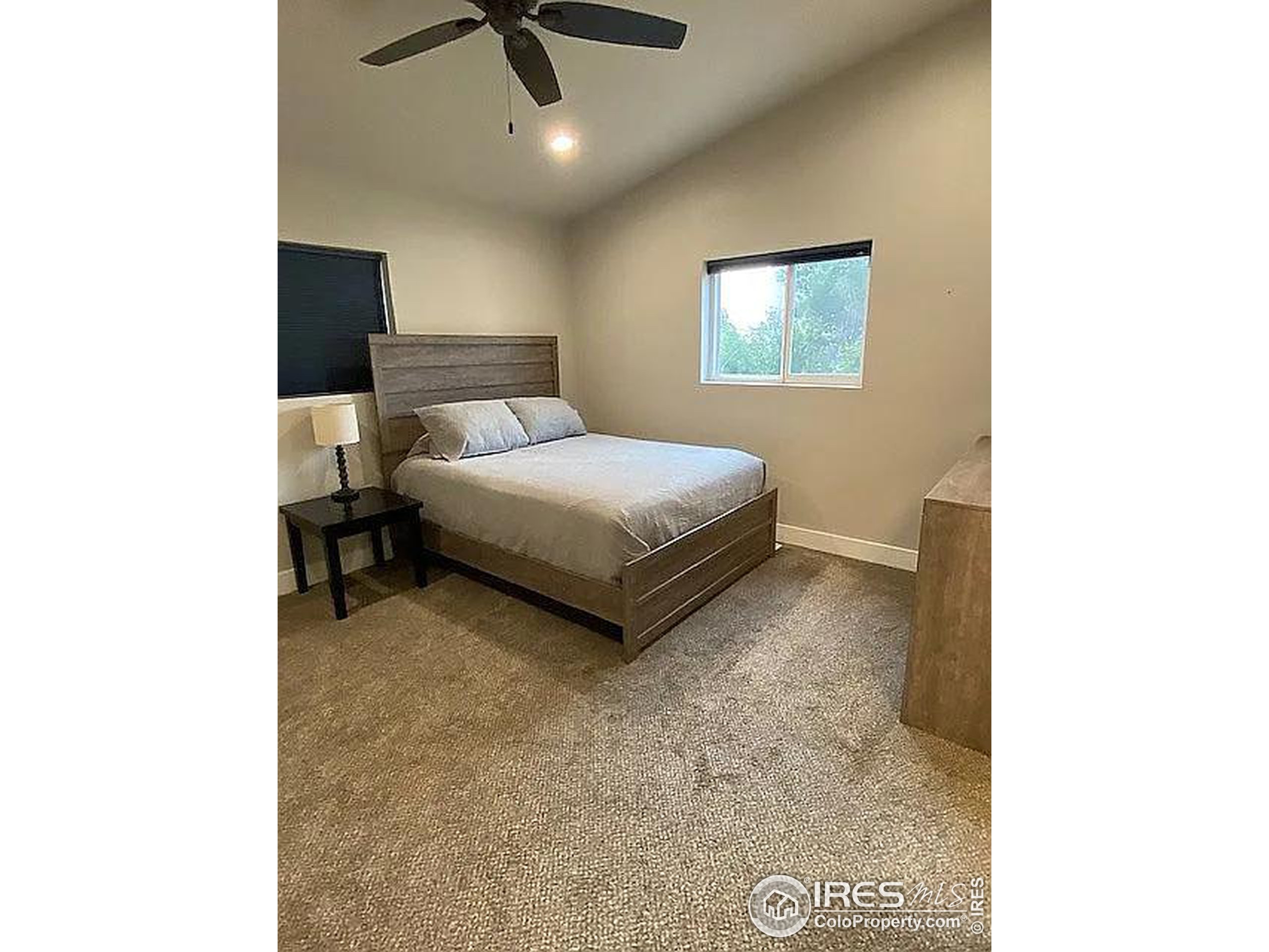 313 West Furry Street Holyoke, CO 80734 - Photo 10 of 23 a living room with a bed furniture and a window