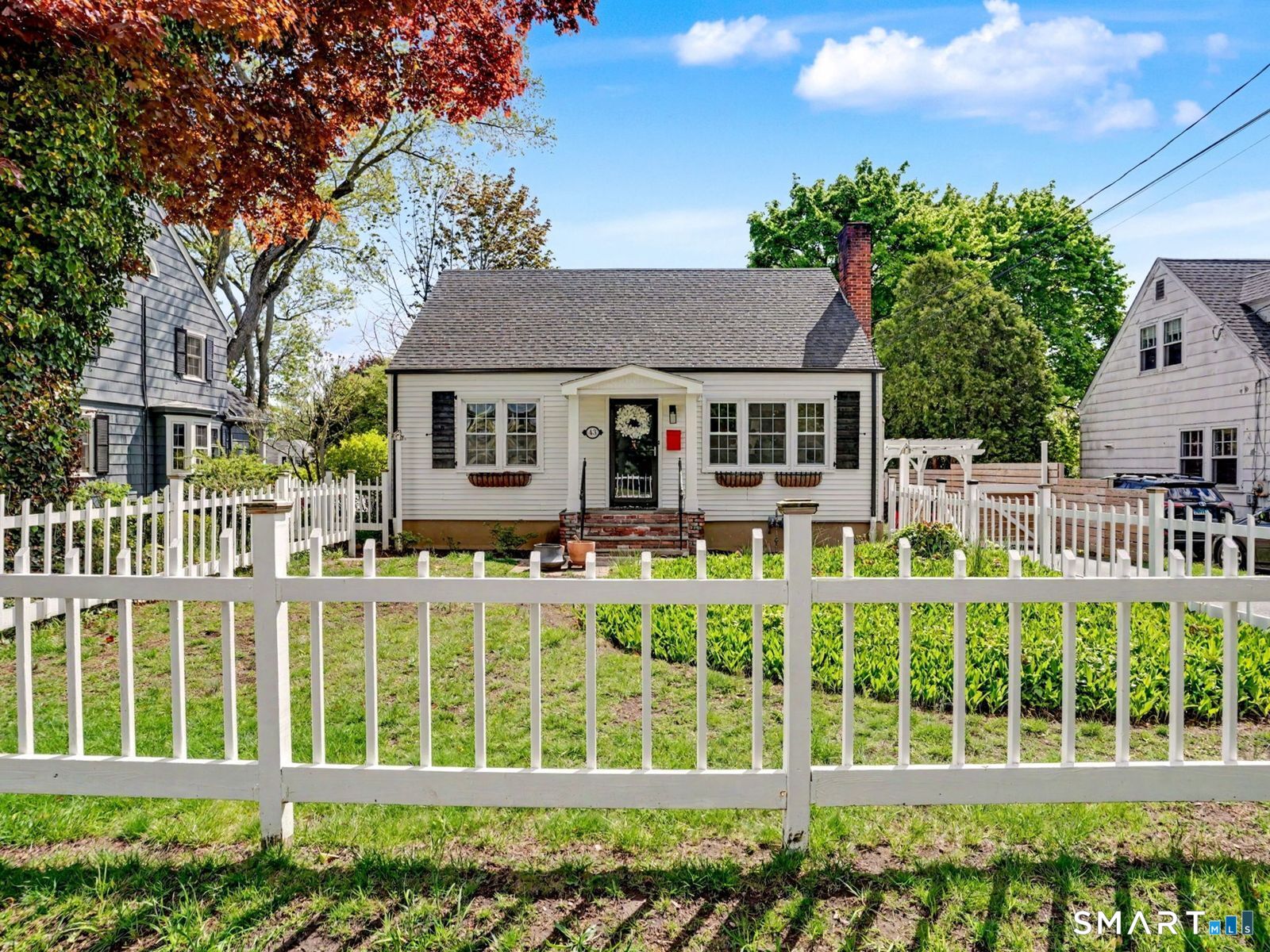 43 George Avenue Norwalk, CT 06851 - Photo 1 of 39 front view of a house with a garden