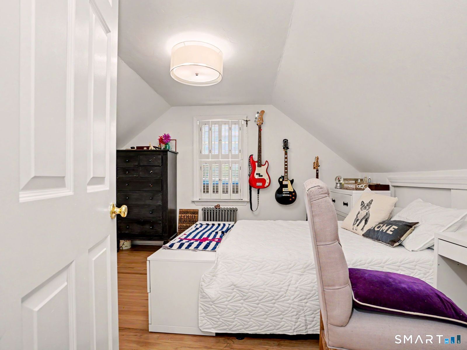 43 George Avenue Norwalk, CT 06851 - Photo 19 of 39 a bedroom with bed and walk in closet with living room