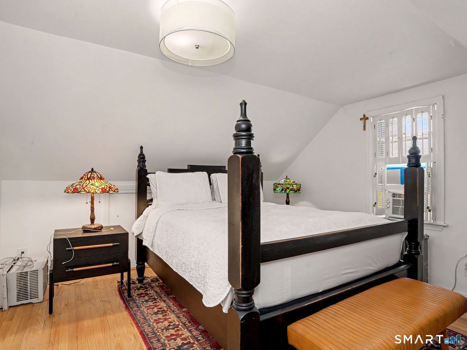 43 George Avenue Norwalk, CT 06851 - Photo 22 of 39 a bed room with a bed and a chair