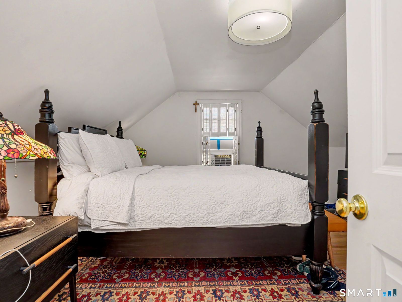 43 George Avenue Norwalk, CT 06851 - Photo 23 of 39 a bed sitting in a bedroom next to a window