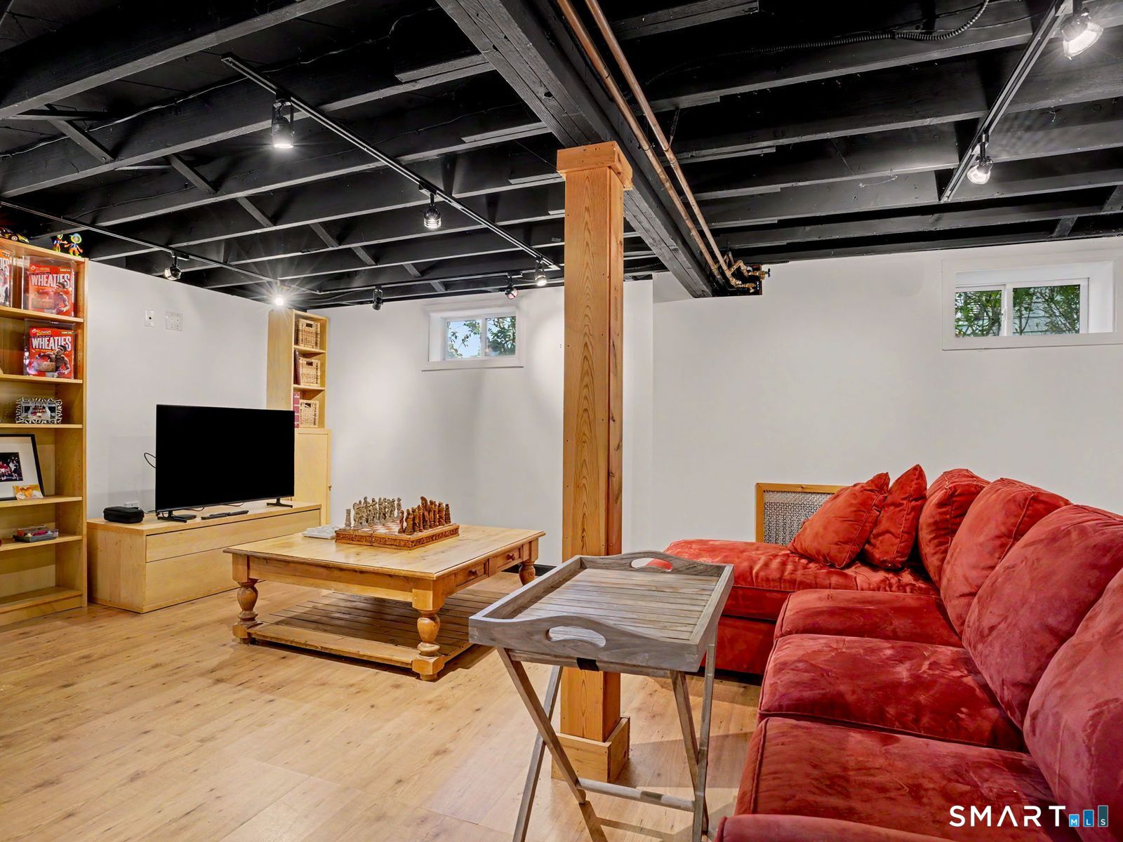 43 George Avenue Norwalk, CT 06851 - Photo 29 of 39 a bedroom with a bed and a flat screen tv