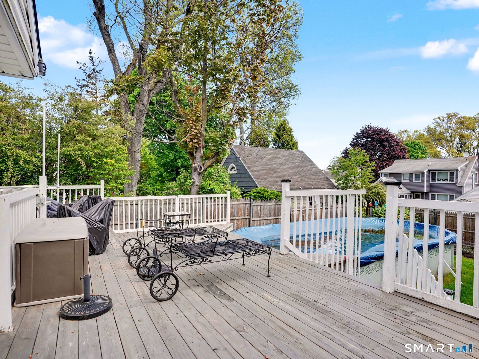 43 George Avenue Norwalk, CT 06851 - Photo 32 of 39 a view of a deck with furniture and wooden floor