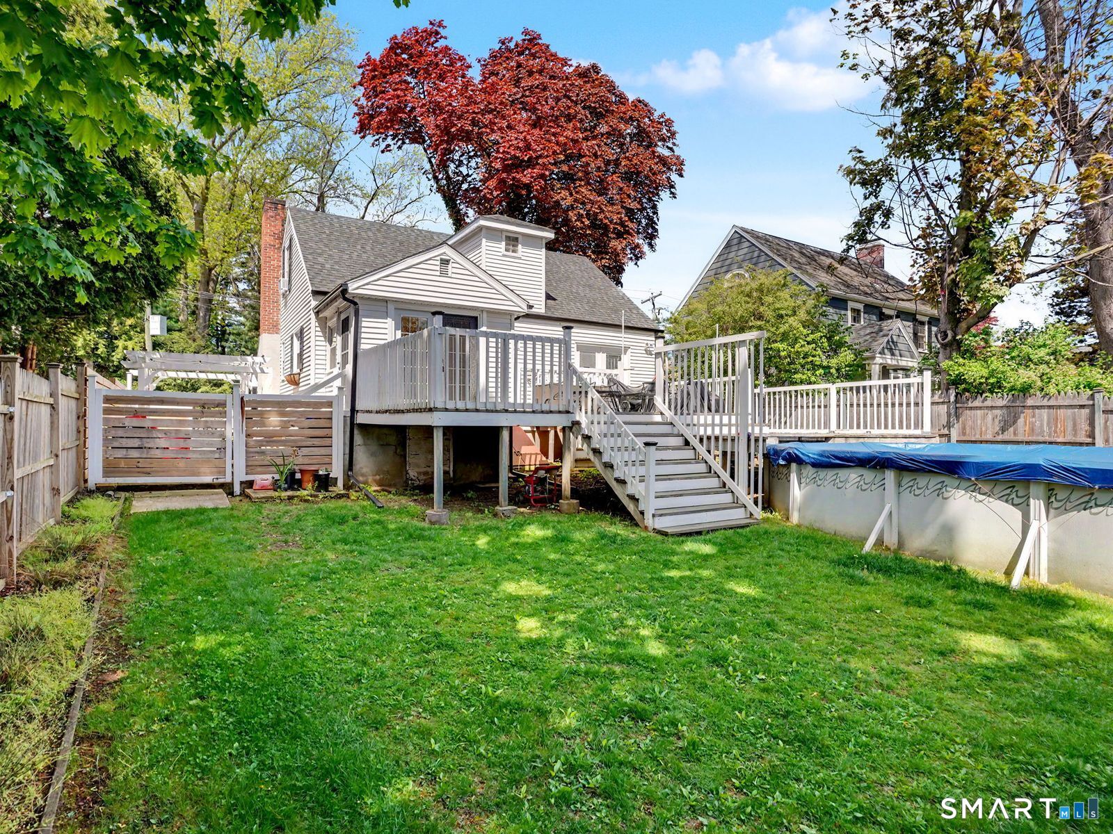 43 George Avenue Norwalk, CT 06851 - Photo 33 of 39 a view of a house with a backyard and a deck