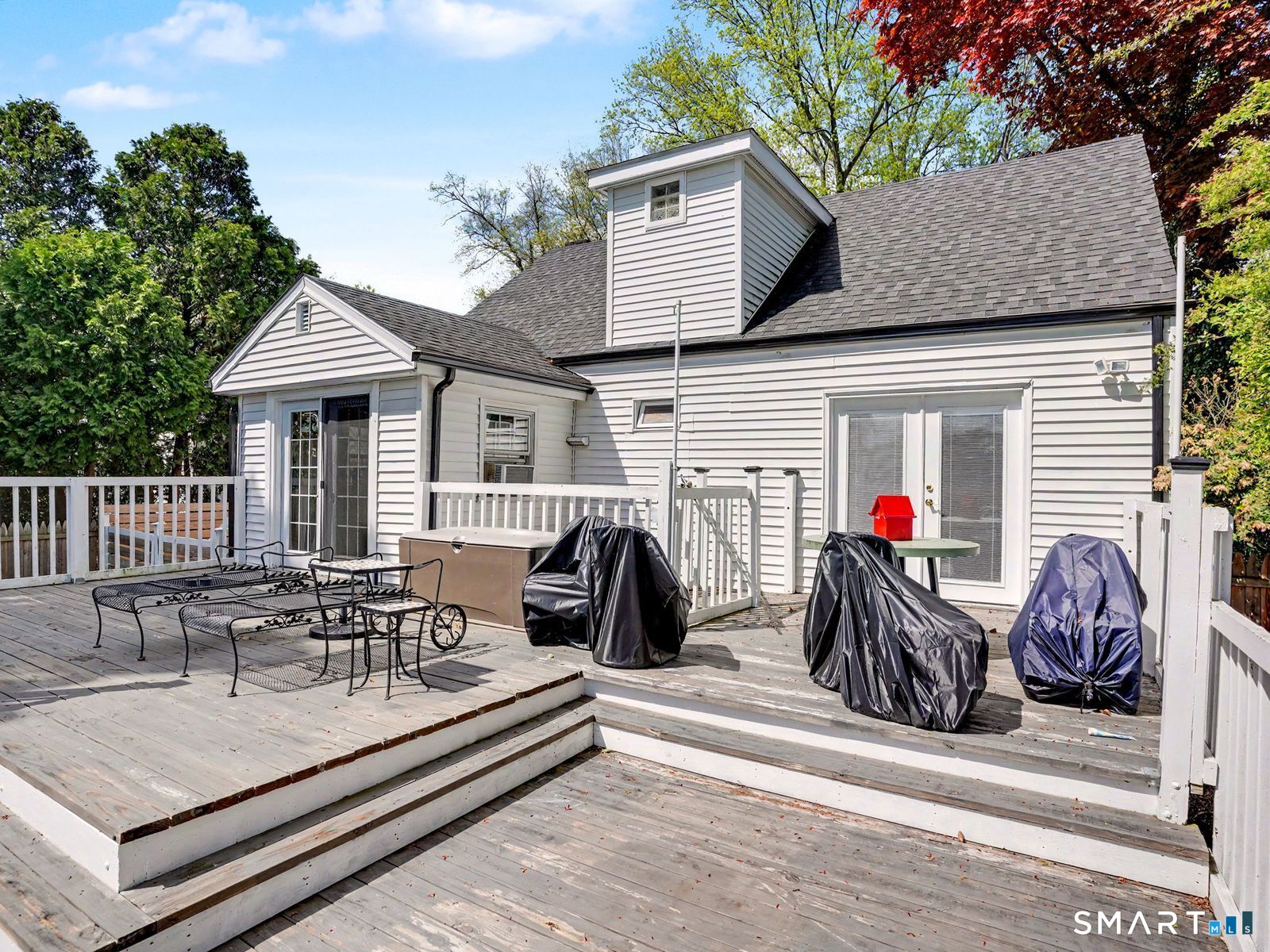 43 George Avenue Norwalk, CT 06851 - Photo 34 of 39 a view of a patio with table and chairs and a barbeque