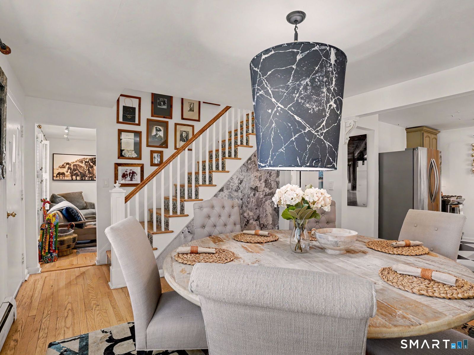 43 George Avenue Norwalk, CT 06851 - Photo 4 of 39 a dining room with furniture and chandelier