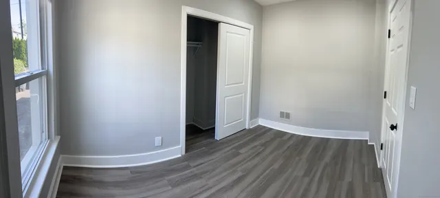 a view of wooden floor in an empty room