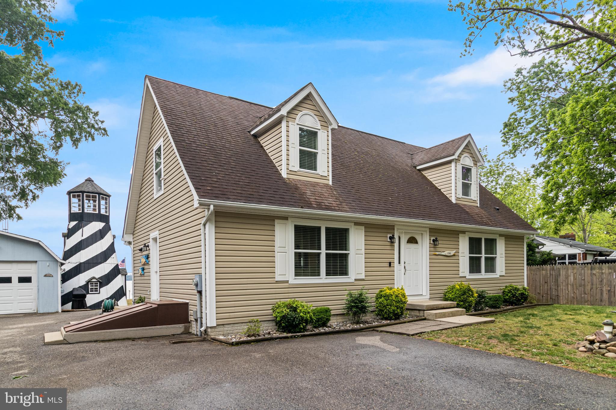 12015 Woodbury Road Nanjemoy, MD 20662 - Photo 26 of 53 a front view of a house with a yard