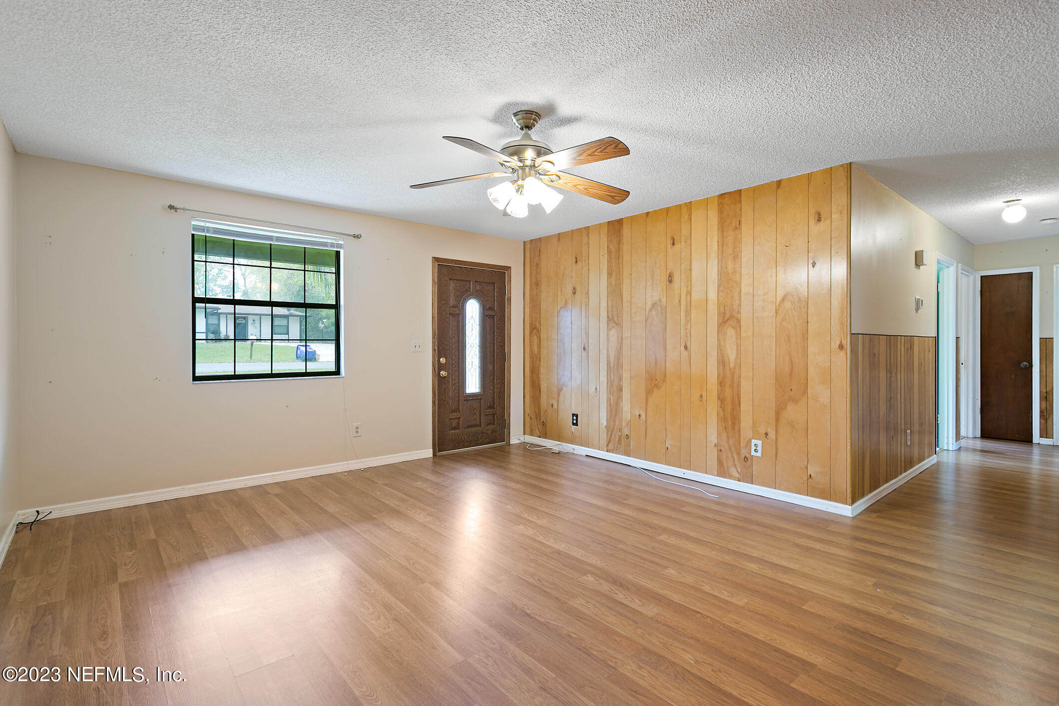 209 Jasmine Road St. Augustine, FL 32086 - Photo 15 of 35 a view of an empty room with window and wooden floor