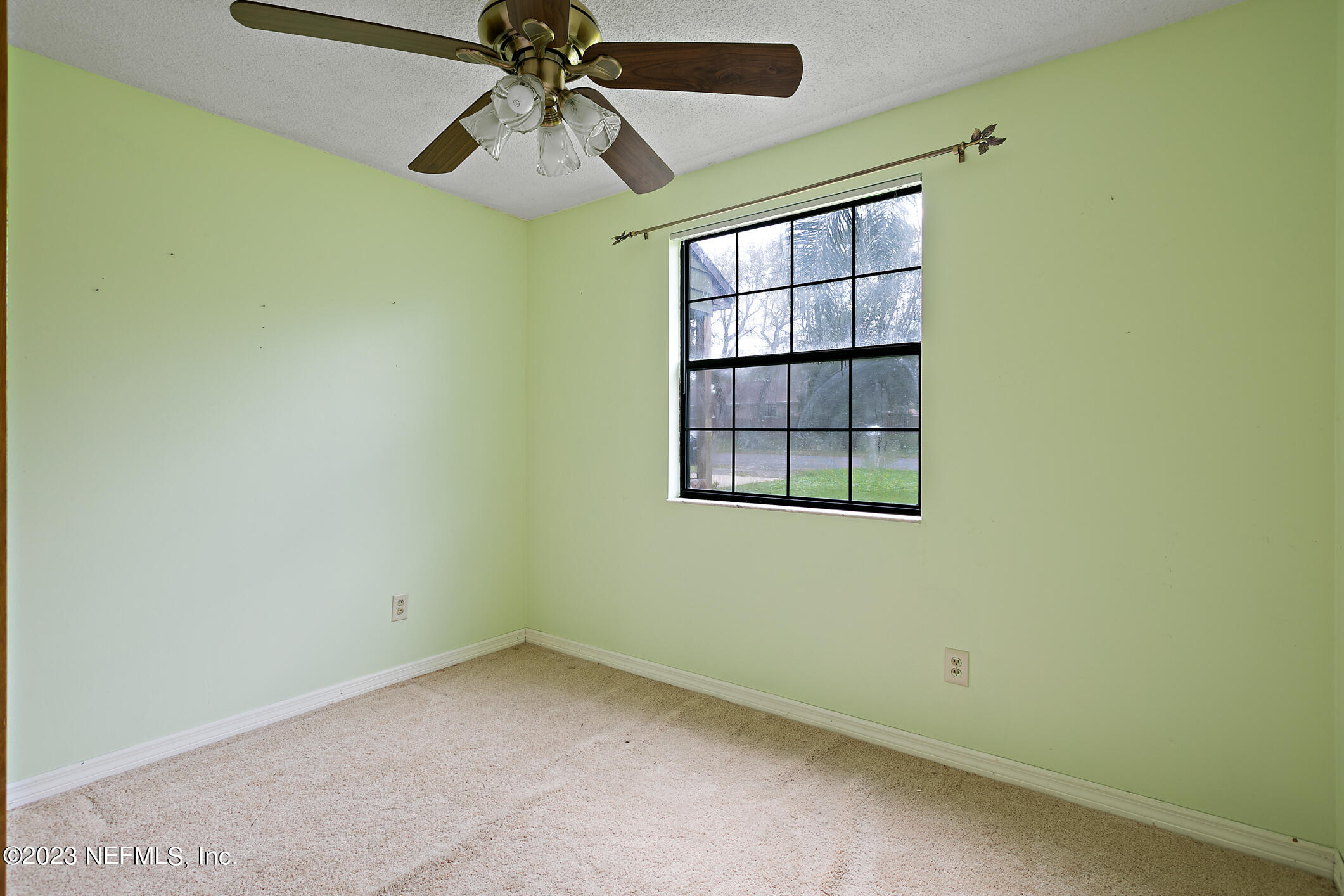 209 Jasmine Road St. Augustine, FL 32086 - Photo 16 of 35 an empty room with windows and fan