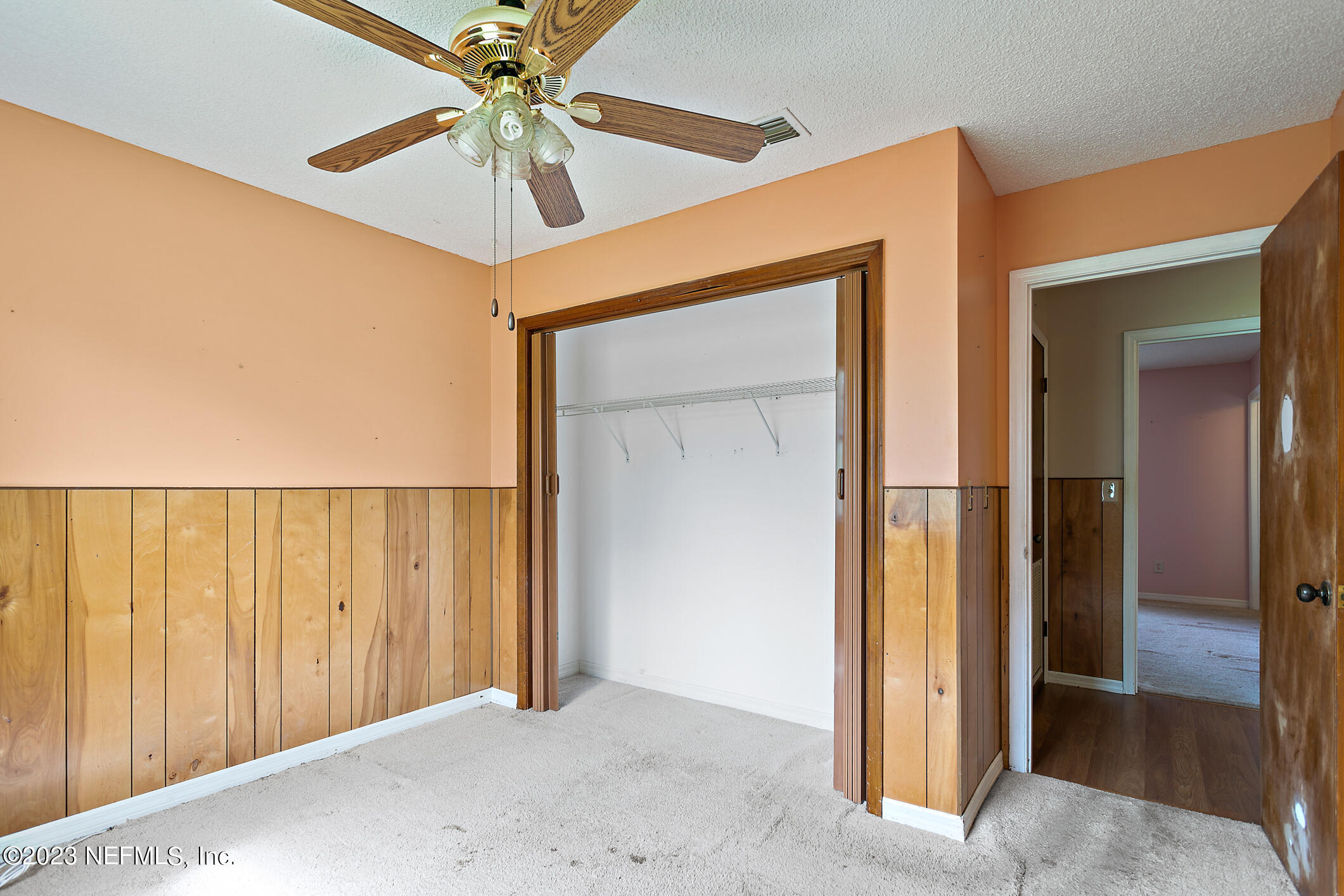 209 Jasmine Road St. Augustine, FL 32086 - Photo 20 of 35 a view of a hallway with a chandelier fan
