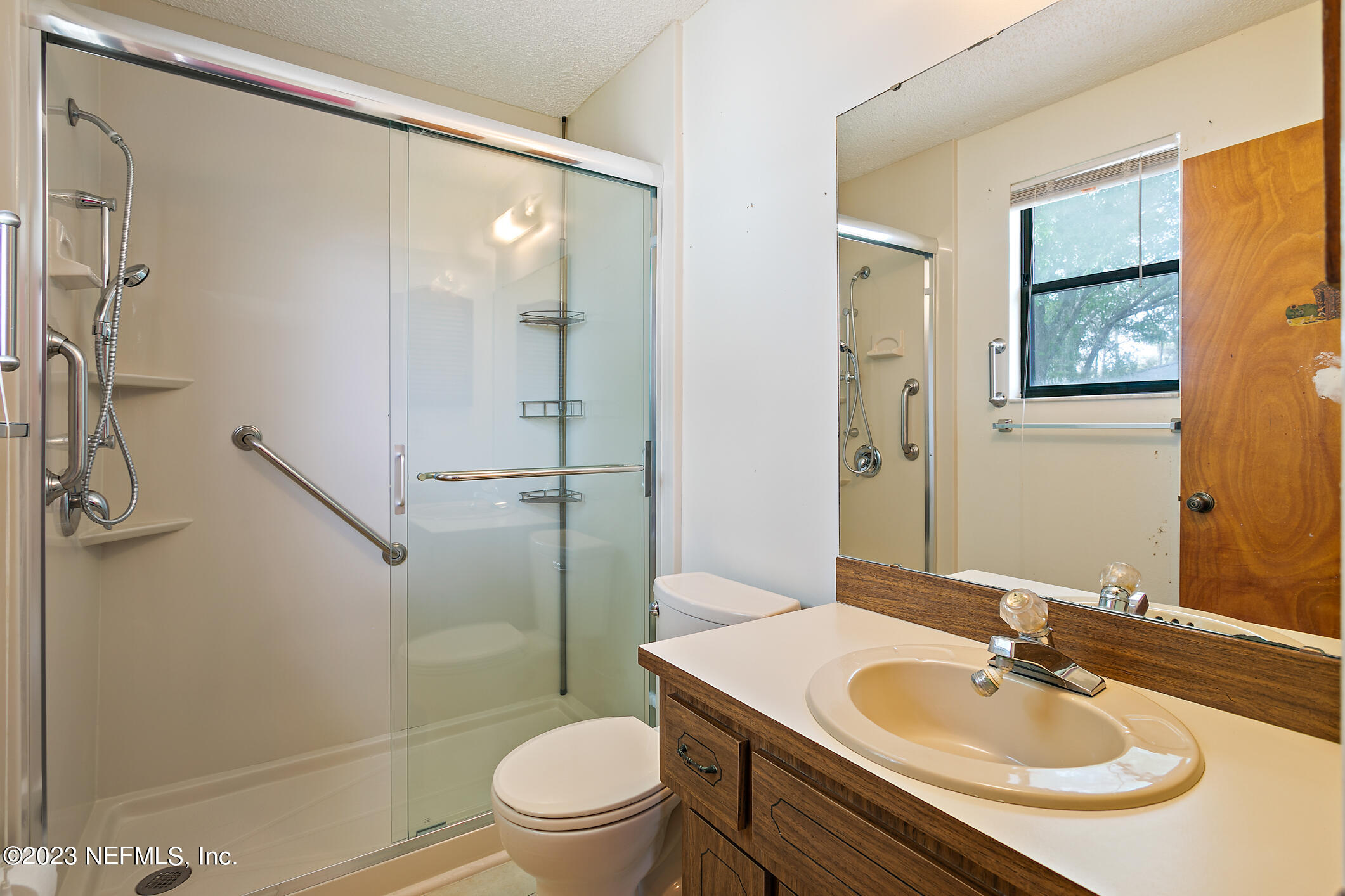 209 Jasmine Road St. Augustine, FL 32086 - Photo 23 of 35 a bathroom with a sink toilet and shower