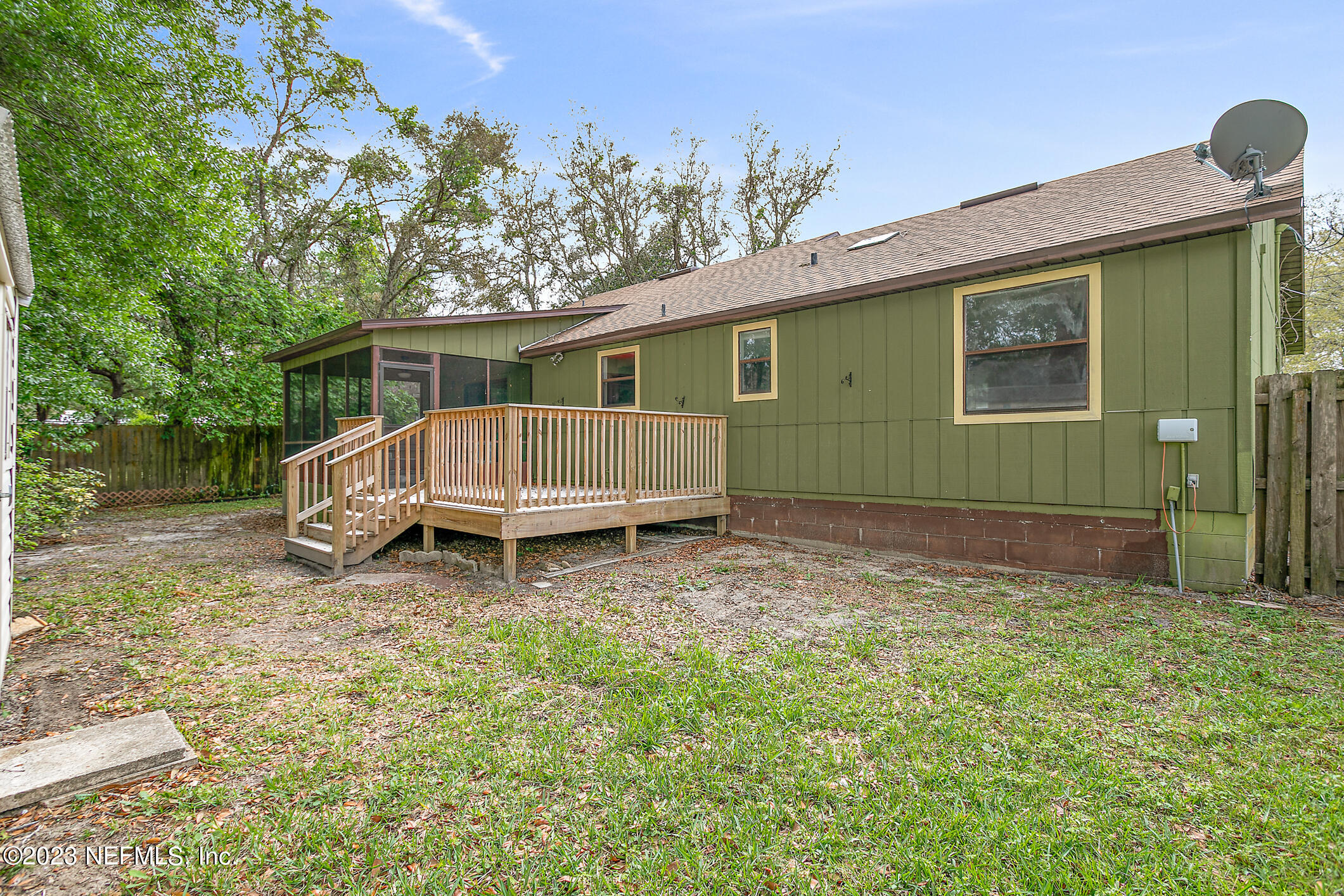 209 Jasmine Road St. Augustine, FL 32086 - Photo 29 of 35 a view of a house with a yard and wooden fence