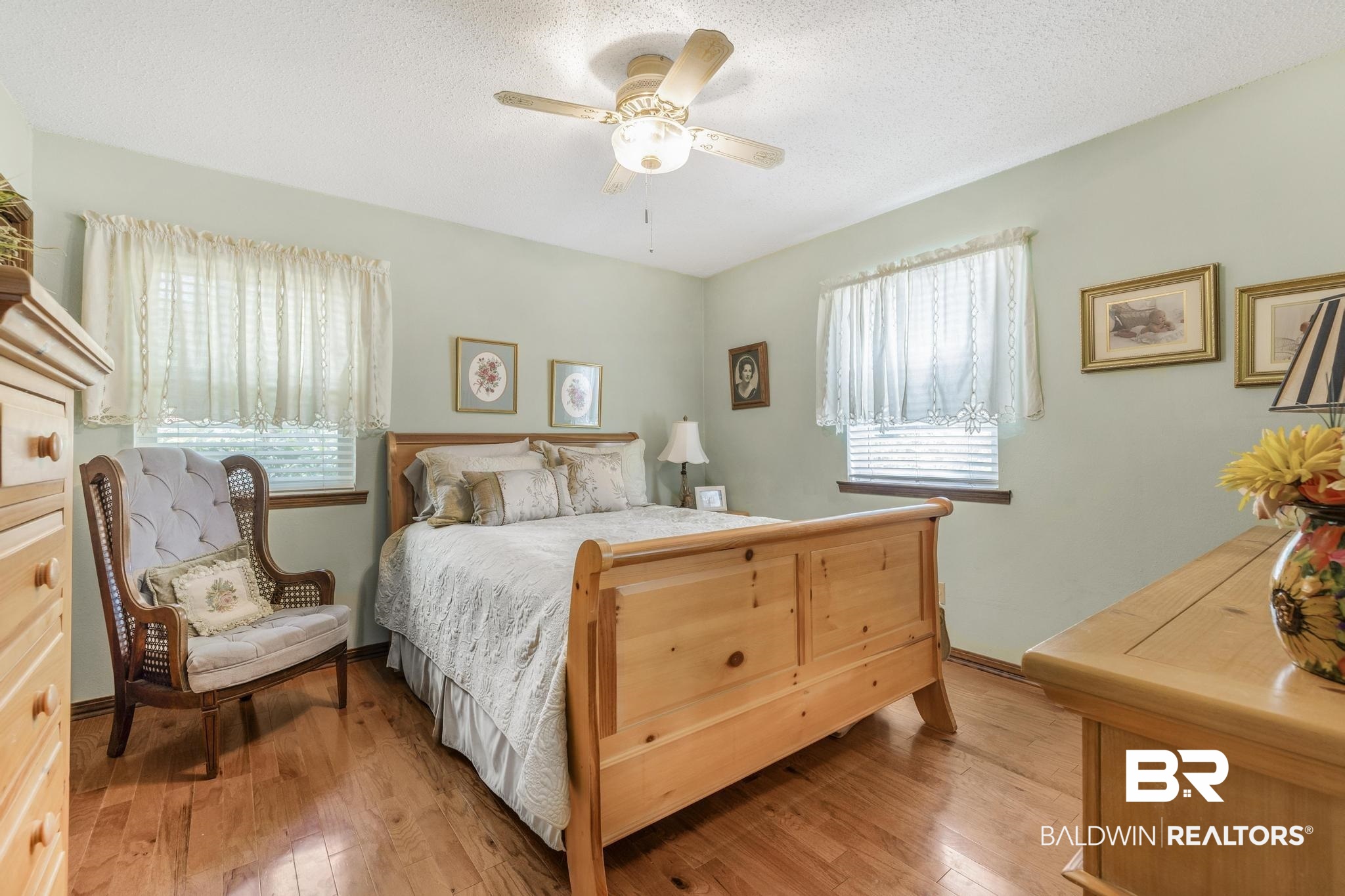 10207 Plantation Drive Daphne, AL 36526 - Photo 24 of 48 Bedroom with light wood-type flooring, ceiling fan, and a textured ceiling